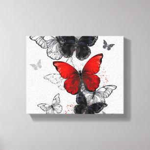 Toile Papillons noirs et rouges volants