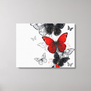 Toile Papillons noirs et rouges volants