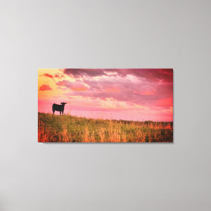 Toile Silhouette de vache au coucher du soleil