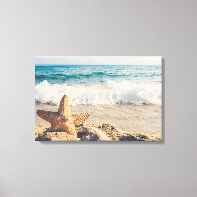 Toile Starfish sur une plage de sable Photo (Recto)