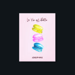 Toile "Sweet Essence of Life Personalized French Macaron<br><div class="desc">Célébrez la douceur de la vie avec notre "Sweet Essence of Life" Imprimé sur toile personnalisée, avec une délicieuse aquarelle de peinture de macarons français (macarons). Cette oeuvre élégante présente un ensemble de macarons aux teintes jaunes, roses et bleues douces, posés contre un charmant arrière - plan rose, qui incarne...</div>