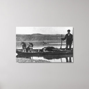 Toile Trappeur dans le canoë avec des peaux et des