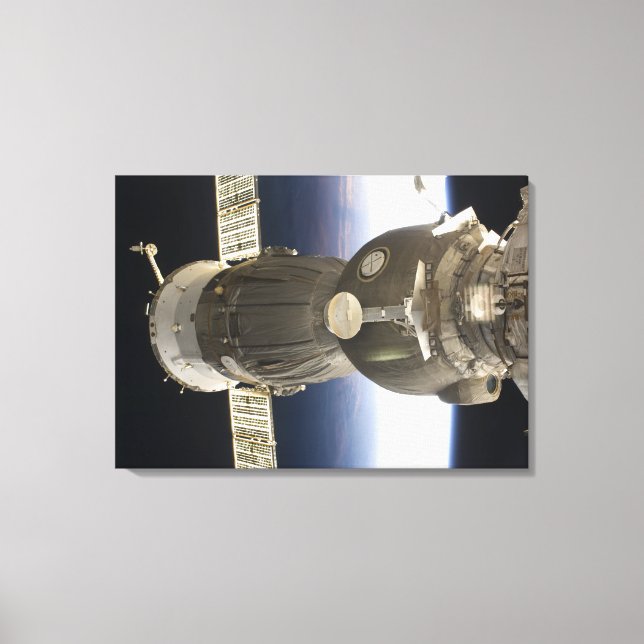 Toile Un engin spatial Soyouz rétroéclairé par la Terre (Recto)
