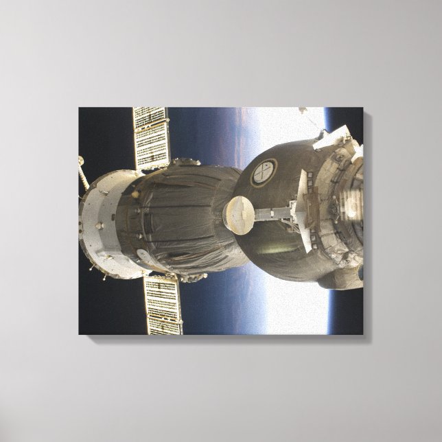 Toile Un engin spatial Soyouz rétroéclairé par la Terre (Recto)
