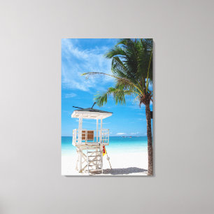 Toile Une plage blanche du courrier de maître nageur,