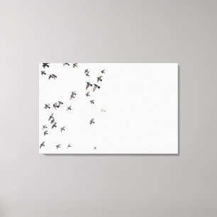Toile Une volée des oiseaux vole au ciel