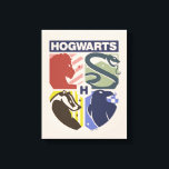 Toile Vintage HOGWARTS™ Stamped Crest<br><div class="desc">Show your house pride in bold, vintage-inspired style with this striking Hogwarts™ crest design. Featuring graphic silhouettes representing the four iconic houses — Gryffindor™, Slytherin™, Hufflepuff™, and Ravenclaw™ — this artwork blends classic symbolism with a modern, retro aesthetic. Each house emblem is set within a clean, color-blocked shield, creating a...</div>