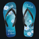 Tongs Modèle floral bleu turquoise Matron d'honneur<br><div class="desc">Ce joli quelque chose de bleu présente d'élégantes fleurs de lotus sur l'arrière - plan bleu turquoise dégradé. Ajoutez votre libellé pour créer facilement vos propres tongs mariages, pour ajouter une dose élégante de glam à votre jour de mariage, de fête de bachelorette ou autre célébration. customisez-le avec votre libellé...</div>