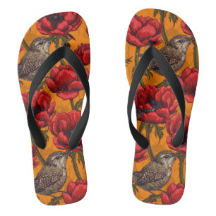 Tongs Wens dans un jardin d'anémones rouges