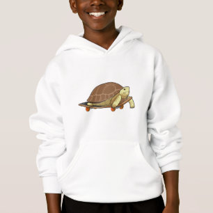Tortue en patinage avec skateboard