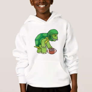 Tortue en sport avec football et casque
