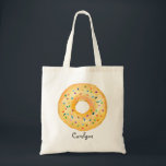 Tote Bag Aquarelle orange mignonne Donut avec arrosage pers<br><div class="desc">Belle Aquarelle orange avec arrosage Sac fourre-tout personnalisé | Sac fourre-tout personnalisable avec beigne orange aquarelle avec arrosage coloré. Ce sac fourre-tout de beignes mignon sera parfait comme cadeau personnalisé. Personnalisez en ajoutant un nom ou une courte phrase. D'autres couleurs de beignes sont disponibles.</div>