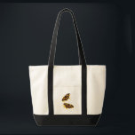 Tote Bag Artistic Watercolor Monarch Butterfly Nature Art<br><div class="desc">The design features two vibrant monarch butterflies in mid-flight, rendered with artistic paint splatters in warm shades of orange and yellow. This nature-inspired graphic captures the delicate elegance of spring wildlife. It makes a wonderful gift for gardeners, entomology enthusiasts, nature lovers, or anyone who appreciates the symbolism of freedom and...</div>