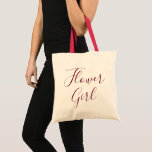 Tote Bag Beautiful flower girl calligraphy<br><div class="desc">A lovely burgundy calligraphy morts for your flower girl,  this one of a enfant morte bag objets a natural color with red handles. "Flower girl" is writes in amazing cursive burgundy text. Purchase yours today !</div>