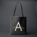 Tote Bag Black Name Gold Girl Script Monogramme moderne<br><div class="desc">Black and Gold Elegant Ajoutez votre propre nom Monogram Book Bag. Ce sac de livre peut être customisé pour inclure votre nom initial et prénom et donné comme cadeau pour Noël,  Sweet 16 Anniversaire,  Fête des mariées ou Mariage.</div>