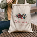 Tote Bag Bouquet de galets rouge mariée d'hiver<br><div class="desc">Rustique élégant mariage floral élégant bridesmaid / femme d'honneur / fleurie sac fourre-tout avec une aquarelle rouge bordeaux et blanc pivoines d'hiver bouquet avec branches saisonnières vert pin, baies rouges et feuillage et blanc votre texte personnalisé. Remplissez vos informations dans les zones, Vous pouvez choisir de le customiser en changeant...</div>