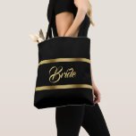 Tote Bag Bride or noir elgant audacieux mariage<br><div class="desc">Deux rubans en faux or,  avec le mot : Mariée dans un script de style écrit à la main,  lettres d'or. Elégante et intemporelle couleur noire arrière - plan.</div>