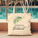 Tote Bag Bridesmaid Palm Leaf fête de naissance personnalis<br><div class="desc">Un cadeau de fête de mariée à personnaliser pour votre femme de chambre - ou n'importe qui dans votre fête de mariage. Bridesmaid est écrit en calligraphie manuscrite tourbillonnant et, vous pouvez facilement passer à un rôle différent, en entrant l'outil de conception. Le design comporte une feuille de palmier tropicale...</div>