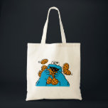 Tote Bag Cookie Monster Eating All the Cookies<br><div class="desc">Satisfy your cravings for fun and cookies with this graphic featuring the one and only Cookie Monster! This showcases a vibrant illustration of Cookie Monster in his element, happily devouring a pile of chocolate chip cookies with crumbs flying everywhere. This classic and instantly recognizable design is cheerful, playful, and sure...</div>