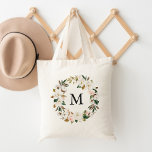 Tote Bag Élégant Blush Floral et Magnolias blanc Monogramme<br><div class="desc">Améliorez votre jeu fourre-tout grâce à nos sacs fourre-tout personnalisés Watercolor Magnolias. L'élégant sac fourre-tout est doté de votre monogramme personnalisé ou initial entouré d'une couronne de magnolias blanches et de fleurs d'aquarelle rose rousse complétées par des feuilles bruns et verts. Les sacs fourre-tout de couronne fleurie sont parfaits pour...</div>