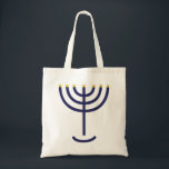 Tote Bag Gold de la marine Menorah<br><div class="desc">Élégant Minorah Navy Gold fourre-tout. Quelle idée géniale pour Sukkot ! Cette fourre-tout pratique dispose d'une menorah marine et dorée élégante. La Menorah d'or est mentionnée dans la Bible dans l'Exode 25:31 ... elle dit... Et tu feras un chandelier d'or pur : du travail battu sera fait le chandelier :...</div>