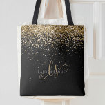 Tote Bag Gold Glitter Glam Monogram Name<br><div class="desc">Glam Gold Glitter Elegant Monogram Tote Bag. Easily personalize this trendy chic tote bag design featuring elegant gold sparkling glitter on a black background. The design features your handwritten script monogram with pretty swirls and your name.</div>