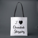Tote Bag Je 🖤 Chanukah. Shopping<br><div class="desc">Amusez-vous avec plaisir et fantaisie à vos courses de vacances avec notre fête I 🖤 Chanukah shopping fourre-tout! Avec un design typographique audacieux et des couleurs noir et blanc contrastées, ce fourre-tout écologique est parfait pour transporter des cadeaux, des courses, et plus encore tout en diffusant la joie de Chanukah"...</div>