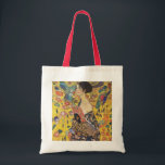 Tote Bag La Dame De Gustav Klimt À La Peinture Art Nouveau<br><div class="desc">Gustav Klimt Lady Avec un peintre Art Nouveau Ce demi-portrait d'une belle femme montre un arrière - plan jaune avec des ornements asiatiques, des oiseaux colorés et des fleurs de lotus. La dame porte une robe dans le style d'un kimono imprimé des motifs d'une robe de dragon chinoise. Belle peinture...</div>