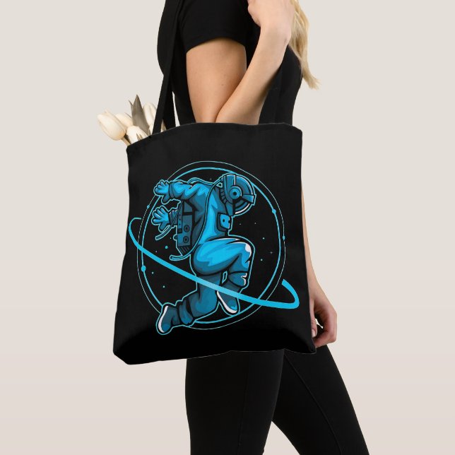 Tote Bag L'astronaute Saute En Dansant Autour De Saturne | (De près)