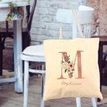 Tote Bag LETTRE Florale M Aquarelle rose et ivoire Bouquet<br><div class="desc">Sac fourre-tout personnalisé avec votre monogramme - nom et origine. La lettre fleurie M est conçue en parties scintillant rose rose et décorée d'un bouquet rose et ivoire de fleurs d'aquarelle et de verdure. Le modèle est configuré pour que vous puissiez ajouter votre nom dans un script en lettres de...</div>