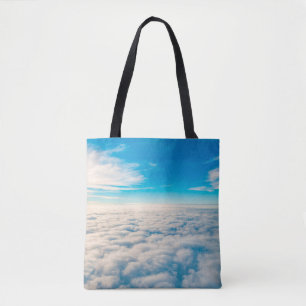 Tote Bag Lever du soleil au-dessus des nuages depuis la fen