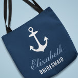 Tote Bag Marine Ancre nautique Custom Wedding<br><div class="desc">Le sac fourre-tout de mariage personnalisé comprend une ancre de bateau avec un texte personnalisé qui peut être personnalisé avec le nom et le rôle de la personne dans votre fête de mariage. Un motif d'ancrages rouge, bleu nuageux, gris et blanc apparaît sur le côté arrière. La couleur bleu marine...</div>