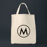 Tote Bag Monogramme noir minimal élégant<br><div class="desc">Ce design de sac fourre-tout moderne est doté d'un monogramme minimaliste et élégant avec votre premier en gras de texte noir pour un look simple et professionnel.</div>