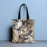 Tote Bag Monogramme Tropical Floral Gold Navy<br><div class="desc">Ce design chic et moderne présente votre monogramme sur un arrière - plan d'un motif floral tropical en or et bleu marine. #floral #tropical #navy #navyblue #gold #golden #botanical #feuillage #personnalisé #monogramme #initial #élégant #chic #stylish #moderne #girly #feminine #fourre-tout #sacs #sacs fourre - touts #accessoires #bureau #work #school #giftsforher #personalizedcadeaux...</div>