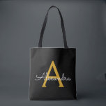 Tote Bag Noir Nom Gold White Girl Script Monogramme moderne<br><div class="desc">Black and Gold Elegant Ajoutez votre propre nom Monogram Book Bag. Ce sac de livre peut être customisé pour inclure votre nom initial et prénom et donné comme cadeau pour Noël,  Sweet 16 Anniversaire,  Fête des mariées ou Mariage.</div>