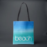 Tote Bag Océan Aquarelle Plage Bleu Vert<br><div class="desc">Cette conception de plage présente un texte en détresse sur un fond bleu et vert d'océan à l'aquarelle. Cliquez sur le bouton Personnaliser pour les options de modification ou d'ajout de texte ! Des variations de cette conception, des couleurs supplémentaires, ainsi que des produits coordonnés sont disponibles dans notre boutique,...</div>