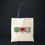 Tote Bag Peace Love Mardi Gras<br><div class="desc">Panneau de paix,  coeur et perles violettes et vertes derrière un masque gras mardi. La semaine la plus amusante du mois de mars !</div>