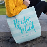 Tote Bag Preppy Blue Stripes Brush Script Bridesmaid<br><div class="desc">Sac fourre-tout Bridesmaid personnalisé avec le mot "Bridesmaid" dans le script de brosse tendance contre un arrière - plan à bandes bleues preppy qui est parfait pour votre demoiselle d'honneur pour porter ses articles. Consultez le sac de maquillage correspondant ici https://www.zazzle.com/preppy_blue_stripes_brush_script_bridesmaid_makeup_bag-223509437047049384?rf=238364477188679314 Personnalisez-le en remplaçant le texte de l'espace réservé. Pour...</div>