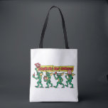 Tote Bag The Gremlins™ Are Coming<br><div class="desc">Get ready for mischief with this bold, retro-inspired design featuring a lineup of playful gremlins marching in with snacks, 3D glasses, and movie-night chaos. With expressive poses, classic creature styling, and vibrant comic-book lettering, this artwork captures the mischievous spirit and cult-favorite energy fans love. The dynamic banner headline and colorful...</div>