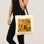 Tote Bag The Kiss Pattern by Gustav Klimt, Art Nouveau<br><div class="desc">The Kiss (pattern detail) by Gustav Klimt is a vintage fine art Victorian Era Symbolism painting. This detail is from a love and romance painting featuring a romantic couple in various shades of gold, symbols and patterns, sharing a kiss against a bronze background. About the artist: Gustav Klimt (1862-1918) was...</div>