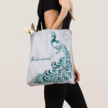 Tote Bag Turquoise Peacock Leaf Vine Bridesmaid Fourre-tout<br><div class="desc">Personnalisez un sac tout en papier pour vos servantes d'accueil avec un Sac fourre-tout Turquoise Peacock Leaf Vine Bridesmaid. Le design de fourre-tout présente un arrière - plan gris clair avec un paon turquoise vibrant orné d'une feuille de vigne. Personnalisez avec le nom de la servante ou gardez le titre...</div>