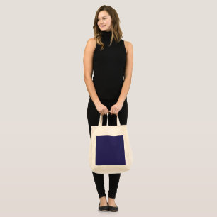 Tote Bag un fond bleu avec une horloge dessus
