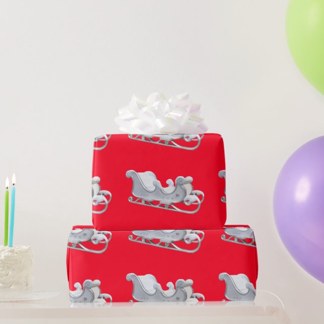 Traîneau blanc sur papier cadeau rouge (Cadeaux de fête)