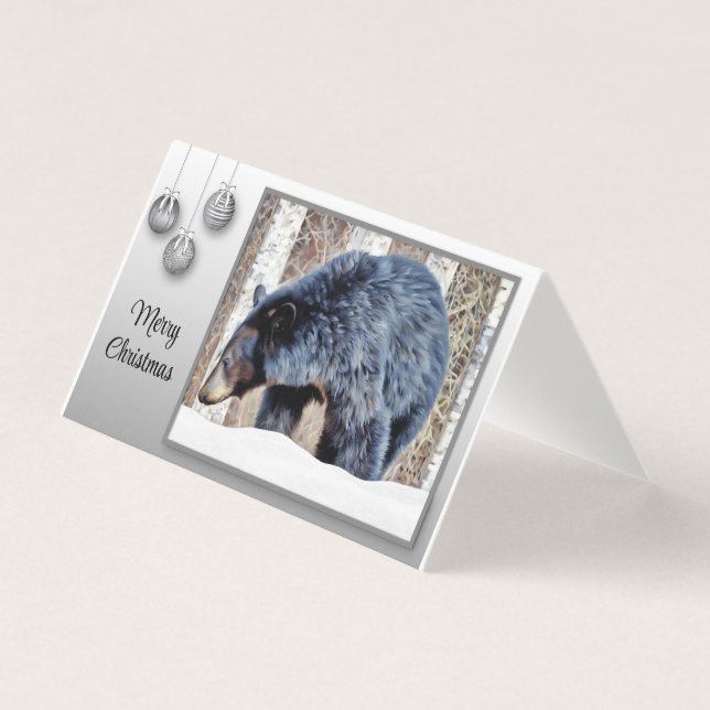 Un bel ours noir dans la neige. (Front)