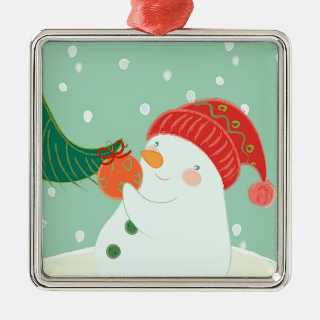 Un bonhomme de neige accrochant un ornement sur un (Devant)