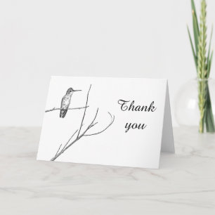 un colibri sur un bâton merci