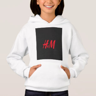 un logo h et m rouge sur fond noir