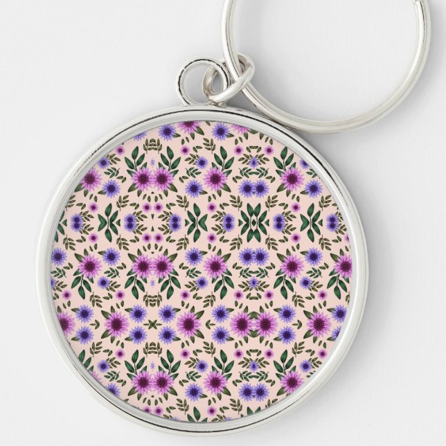 Un porte-clés rond présente une fleur détaillée  (Devant)