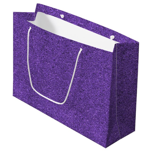 Un sac cadeau pailleté violet avec une poignée bla (Devant Angle)