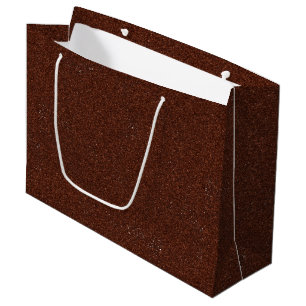 Un sac en papier brun avec une poignée blanche